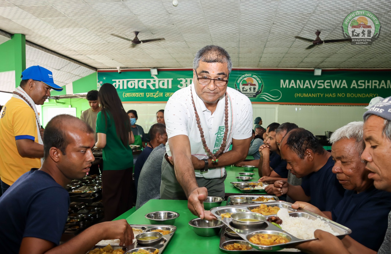 Meal service at Manav Sewa Ashram on the occasion of the club's charter day